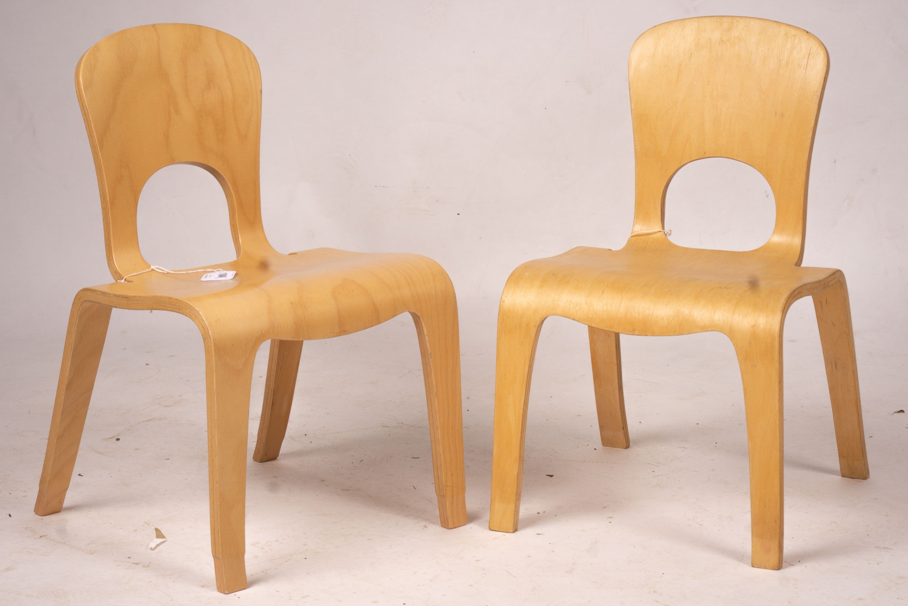 A pair of ‘Comunity’ ergonomic design children’s chairs, 55cm high max.